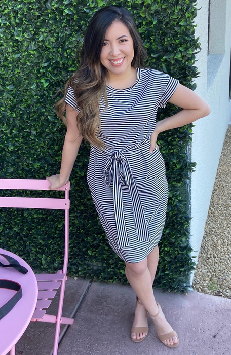 Another reviewer wears a black and white striped outfit.