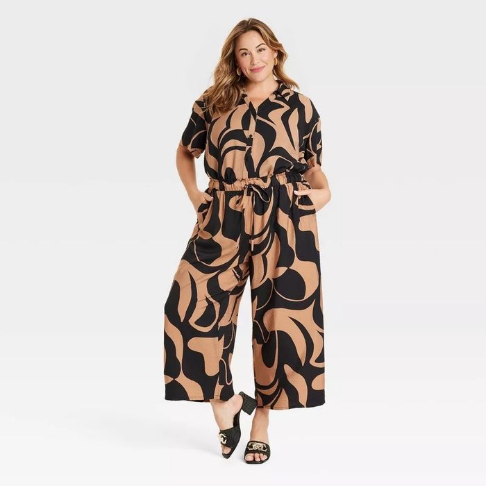 Model rocking a matching short-sleeve blouse and cropped wide-leg pants set with a fun, swirling pattern