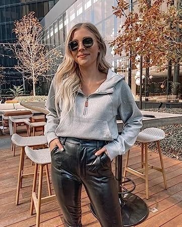 Model dressed in gray attire.