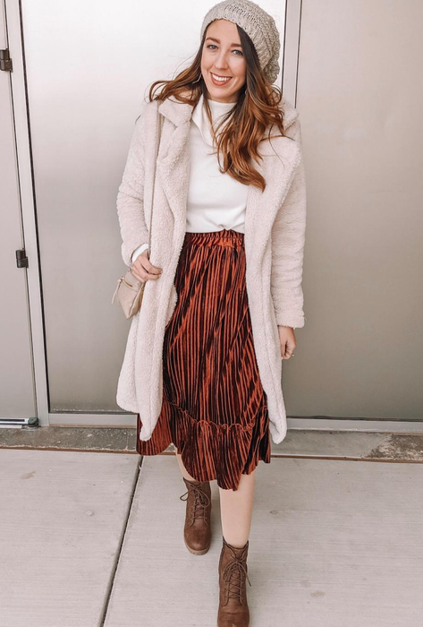 A reviewer dressed in a white coat