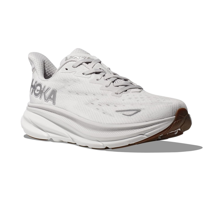 A HOKA running shoe featuring a thick, cushioned sole is shown. The design prioritizes comfort and support for physical activities.