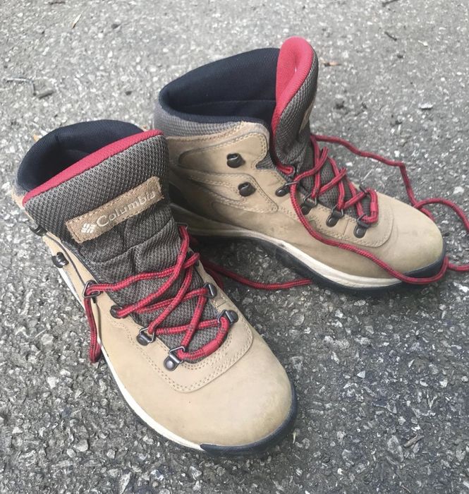 The shoes resting on the ground.