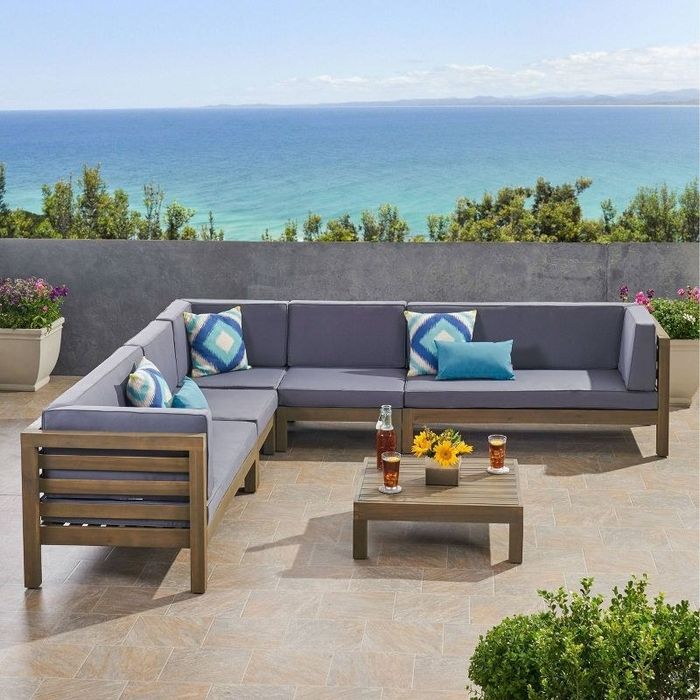 the sectional set in dark gray on a terrace