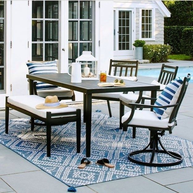 the bench paired with a matching table and chairs