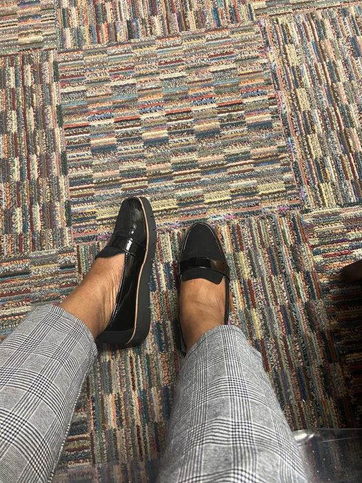 A reviewer sporting the shoes in shiny black patent leather.