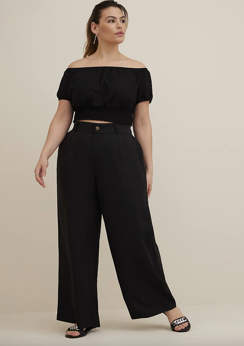 Model wearing black linen pants
