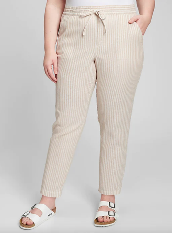 Another model in beige striped linen pants