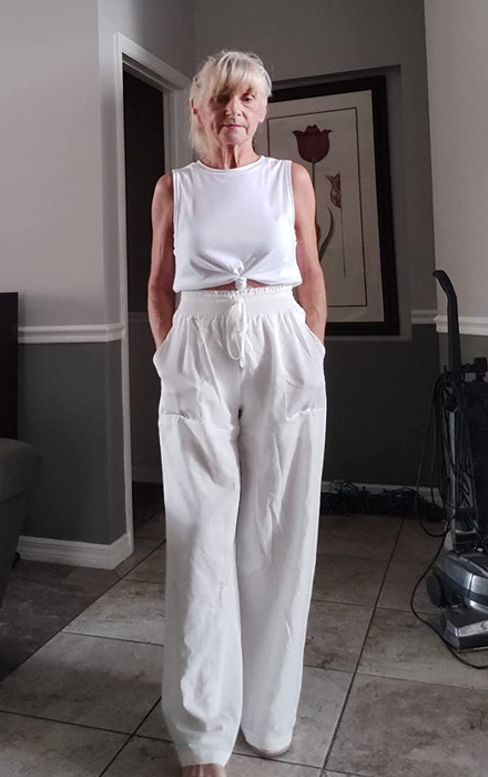 Reviewer photo showing white linen pants