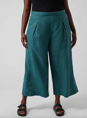 Model wearing turquoise linen pants
