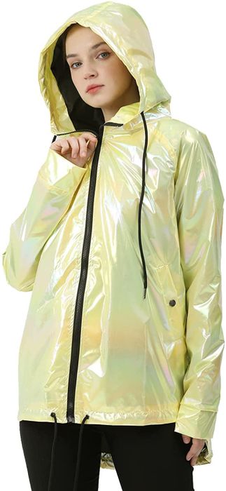 A model showcasing a striking yellow metallic raincoat.