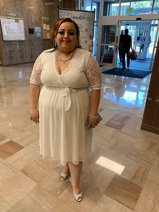 reviewer wearing the lace midi dress