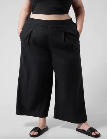 Model wearing black linen pants