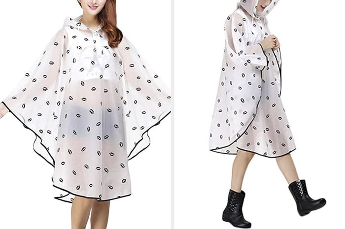 A white poncho featuring black trim and a bold black lips pattern.