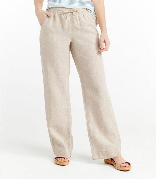 Model showing just the lower half wearing the beige linen pants
