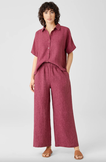 Model wearing magenta linen pants with a matching top