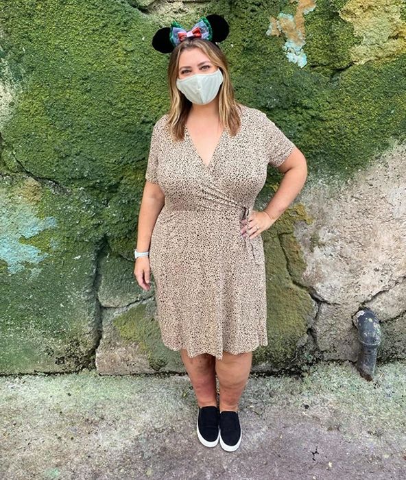 A reviewer is spotted at Disney World, rocking a cheetah print dress.