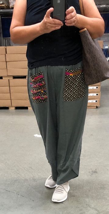 Reviewer mirror selfie showing off the patchwork pants