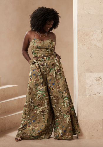 Model showing off floral print wide-leg green linen pants