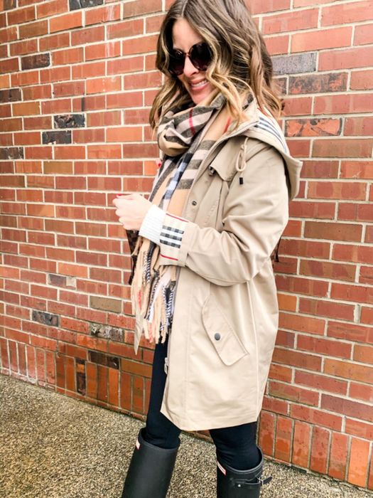 The reviewer is seen sporting a beige jacket.
