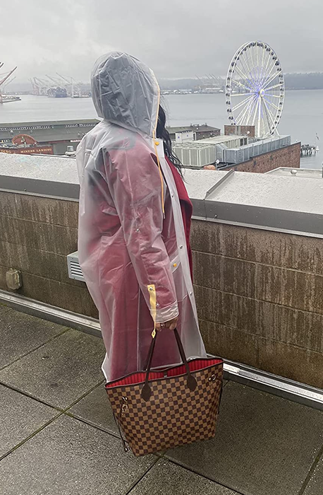 A reviewer seen in the clear raincoat.