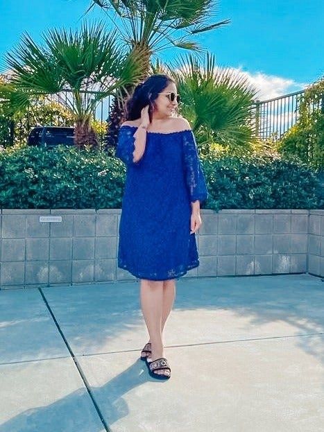 Reviewer in a blue dress.