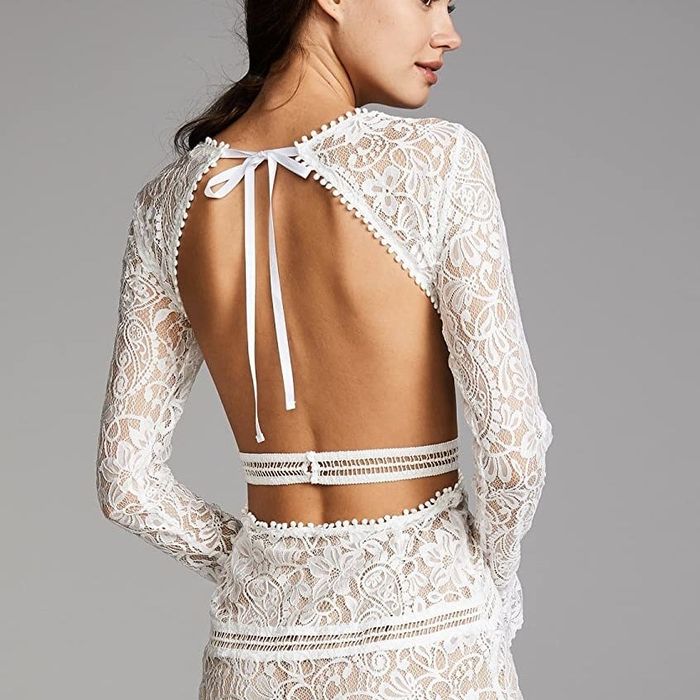 model wearing the open-back dress