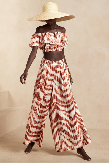 Model wearing red and white linen pants