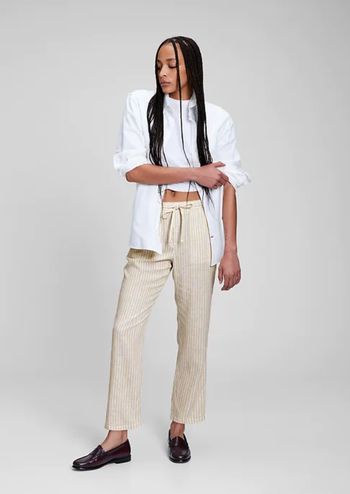 Model styled in beige striped linen pants