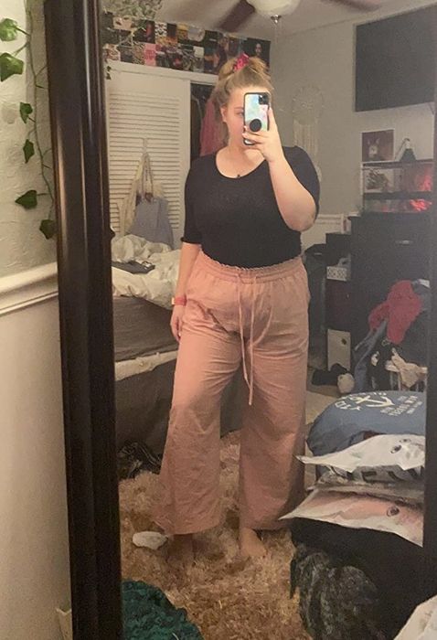 Photo of a woman wearing pink linen drawstring pants