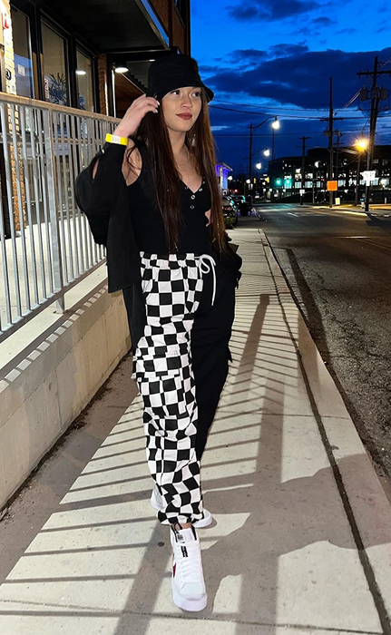 Reviewer wearing black and white checkered cargo joggers
