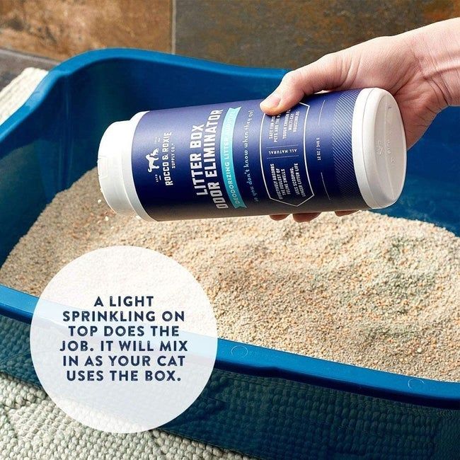 Hand sprinkling the deodorizer into a litter box