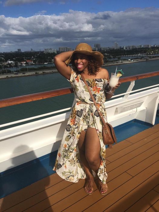 A reviewer enjoying the dress while on a boat