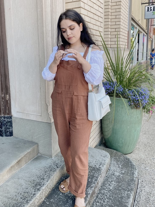 reviewer wearing the orange jumpsuit