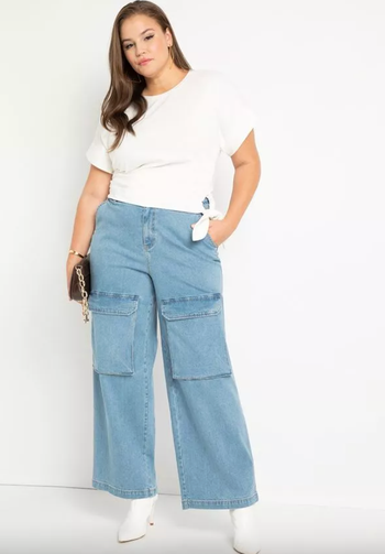 The model is wearing wide-leg cargo jeans.