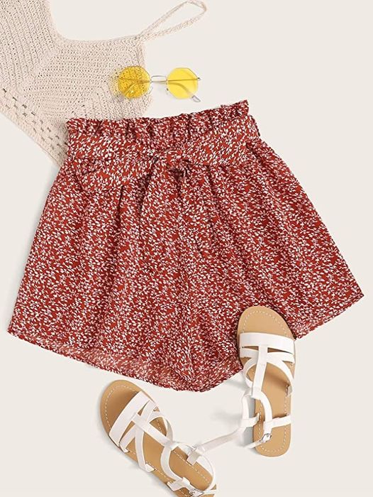 elastic-waist shorts in a red floral pattern with a coordinating tie belt