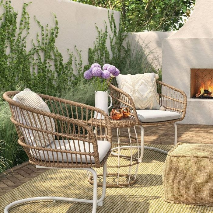 The set, shown here in natural/white, perfectly complements any patio space.
