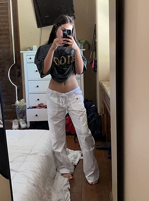 Reviewer mirror selfie wearing white Dickies cargo pants scrubs