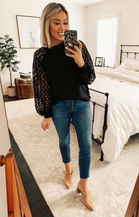 Customer sporting the top in sleek black