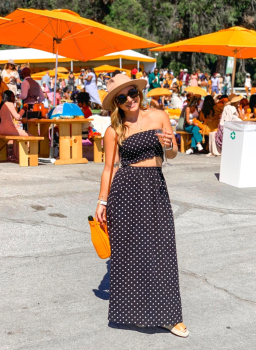 reviewer wearing the black set with a summery hat