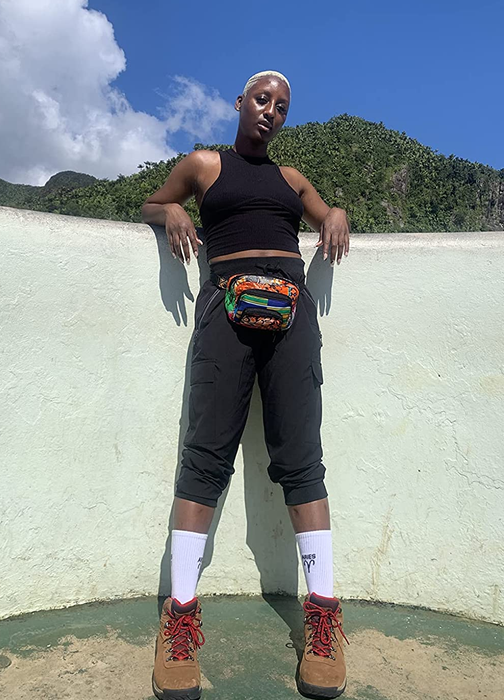A reviewer’s photo showcasing black cargo capris paired with hiking gear.