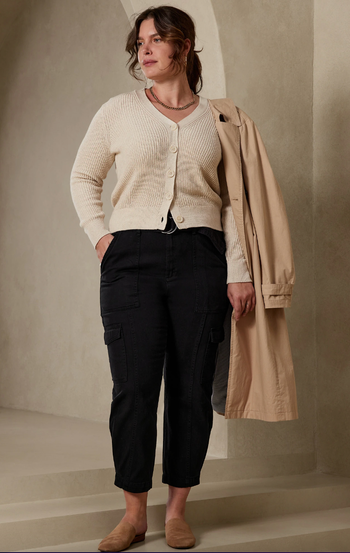 Model wearing black cargo pants