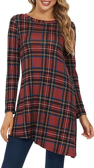 A model wearing a striped version of the tunic