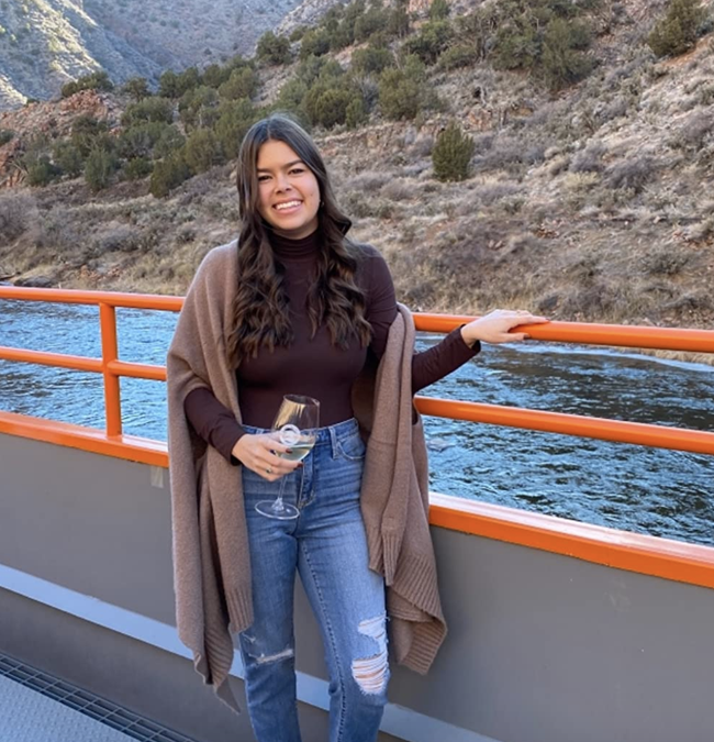 A reviewer wearing the mock-neck bodysuit