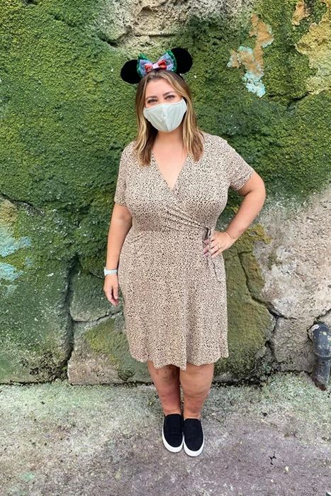 A reviewer dons a cheetah print dress while enjoying Disney World.
