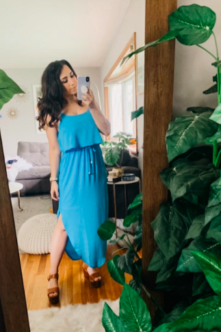 Another reviewer wearing the dress in a vibrant sky blue