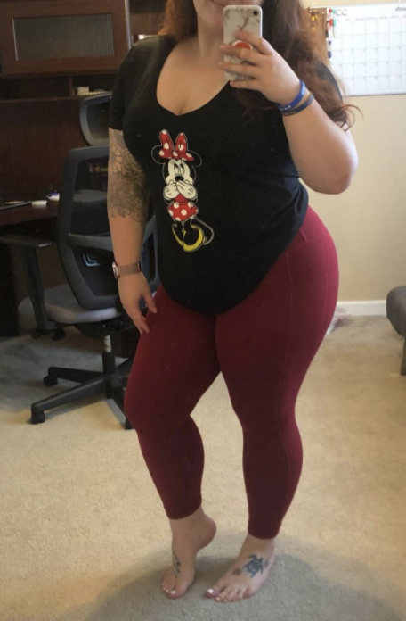 Reviewer wearing burgundy yoga pants