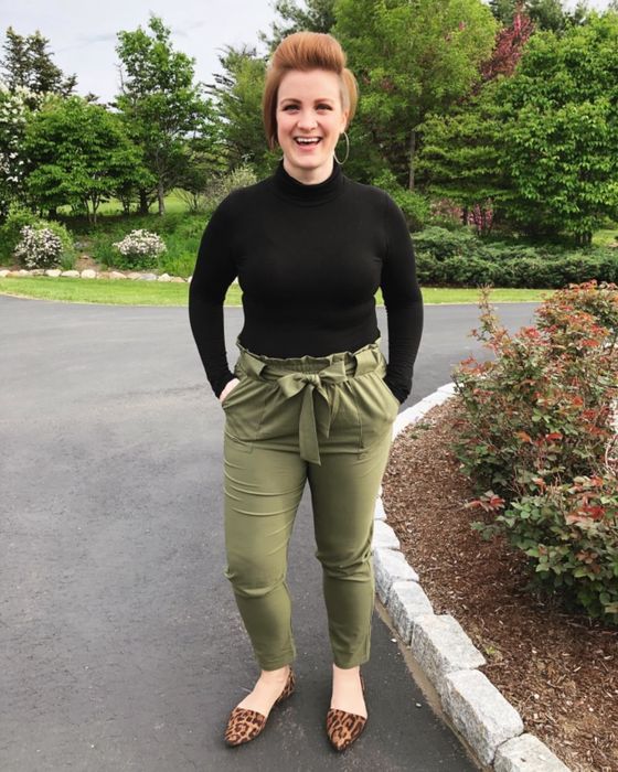 Another reviewer wears olive green pants, a black long-sleeve shirt, and tan flats.