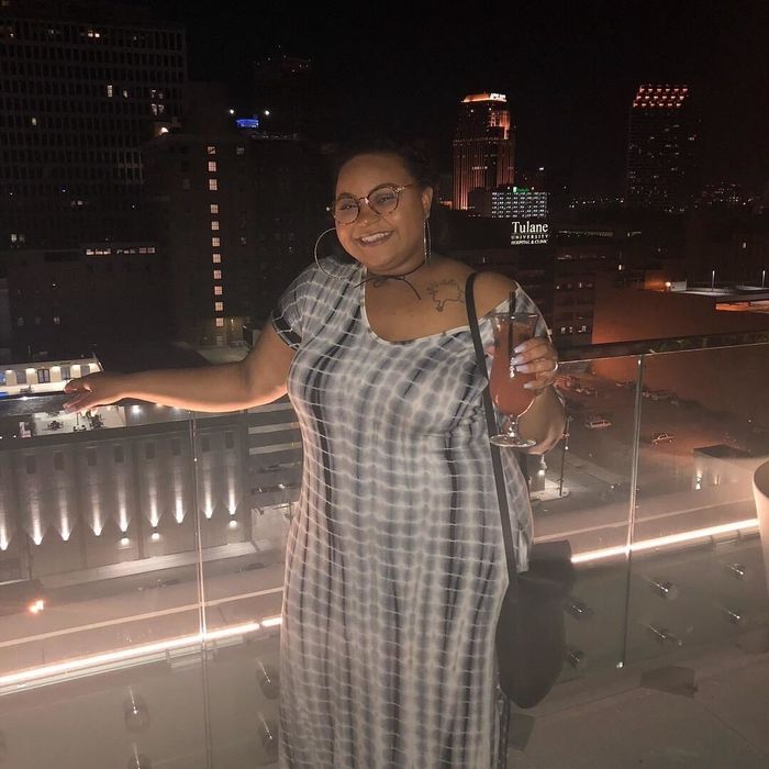 Reviewer wearing a gray dress