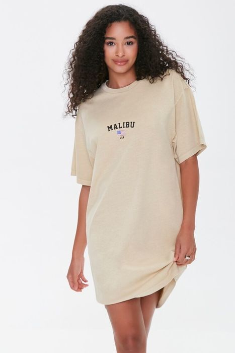 Model wearing the tan T-shirt dress with a