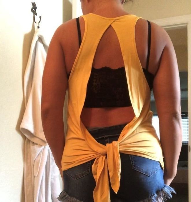 Back view of the tie-back design, highlighting the gap and skin, with the reviewer wearing a black tank.